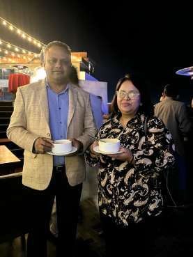 Guests with refreshments at the Dashain and Tihar celebration